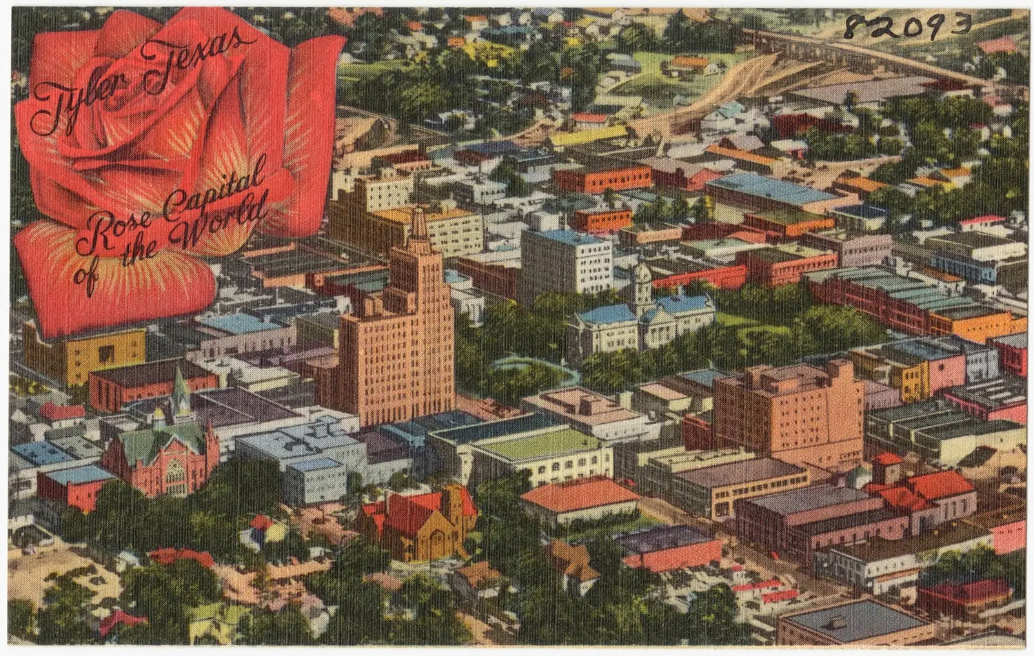 A colored linen postcard: an aerial view of downtown Tyler, with a tall tower, a white building with a cupola among trees, and blocks of low buildings; at the upper left a large red rose carries the script words Tyler Texas, Rose Capital of the World.